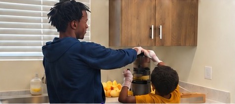 Young people learning to make fresh juice at home